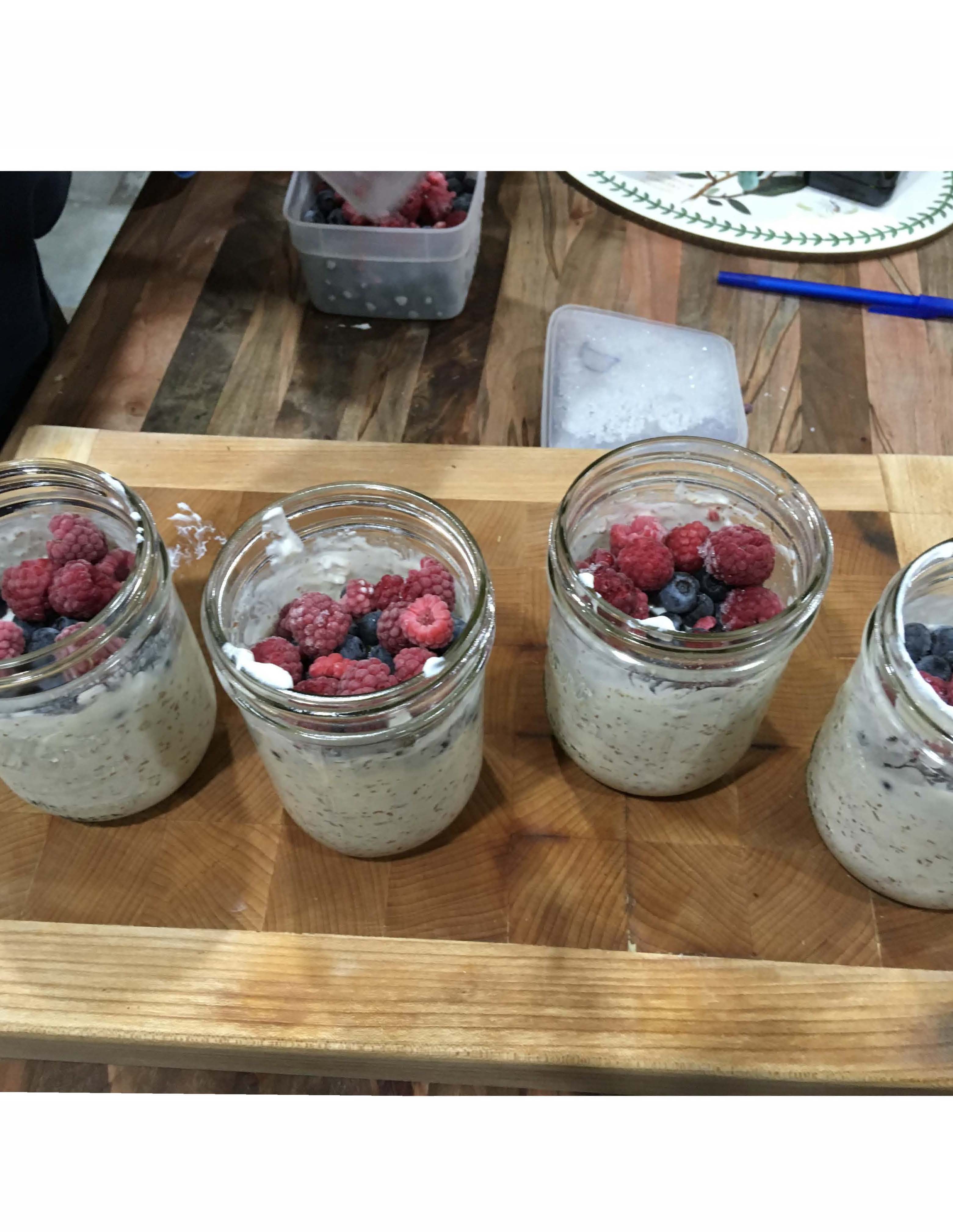 Oats, yogurt, fruit in glass canning jars