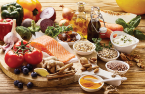 Salmon, grains, nuts, olives, spices, vegetables, vinegar, olive oil