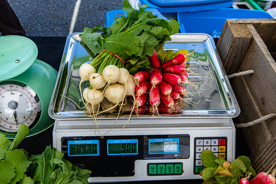 Radishes being weighed for sale.